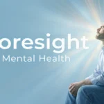 Man looking toward bright light symbolizing clarity and foresight mental health awareness