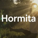 Person stretching in morning sunlight representing balance, vitality, and wellness with Hormita natural supplement.
