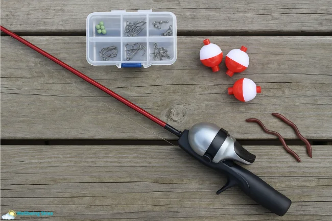 Beginner-friendly fishing gear displayed on a wooden dock for the Thunderonthegulf family fishing guide.