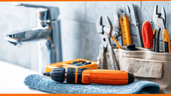 DrHomey Handy Tips: Essential tools for DIY home repairs, including a drill, pliers, and wrench.