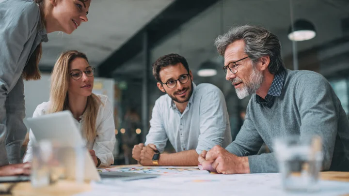 Roarleveraging Business Infoguide by Riproar - Business team collaborating on strategy and planning.